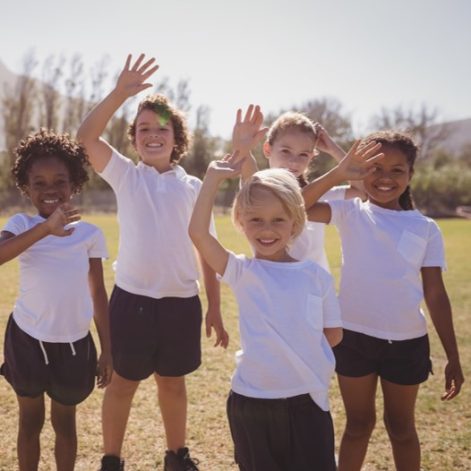 School children waving